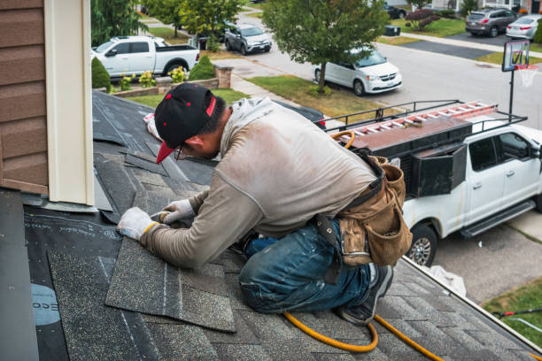Professional Roof Replacement technician working in Harrison, NJ